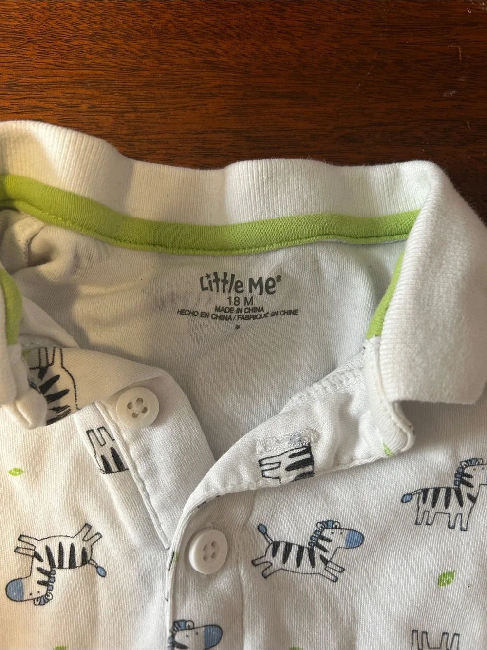 Little Me White Polo Romper with Blue Zebra Print and Green Accents